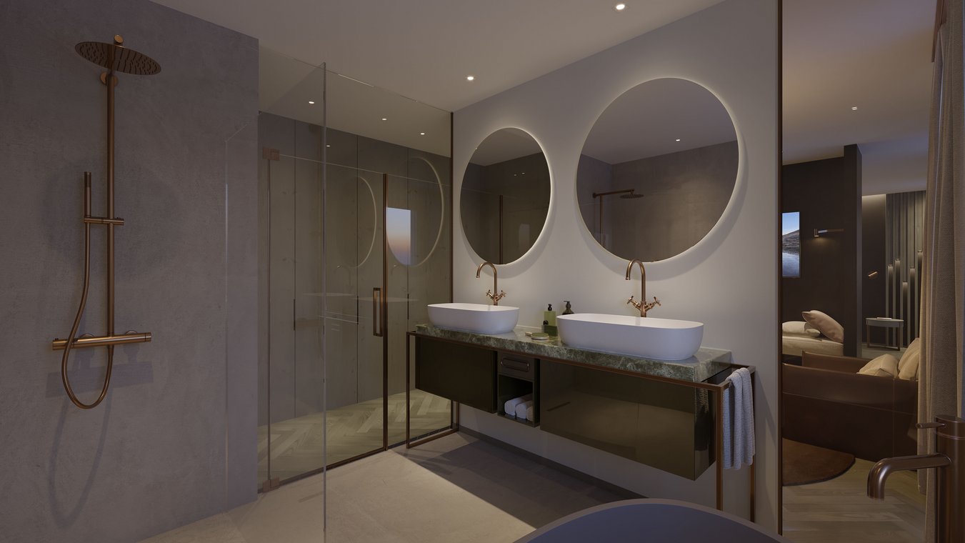 Αρχιτεκτονικός φωτορεαλισμός ενός μοντέρνου μπάνιου στο Parkhotel Beau Site, με δύο στρογγυλούς καθρέφτες και χρυσές βρύσες.